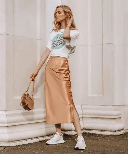 Satin midi skirt outfit with t-shirt and sneakers