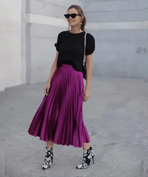 Tonal t-shirt paired with midi skirt and boots